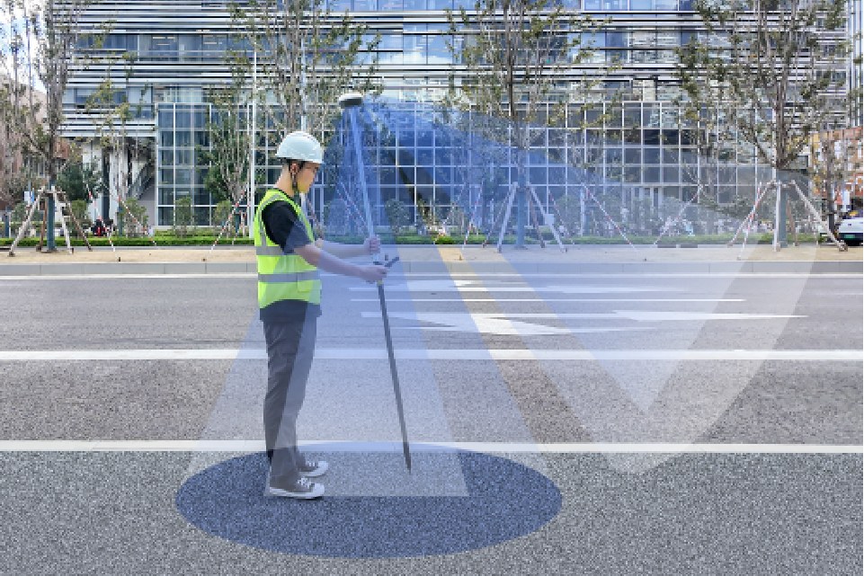 Surveyor with a pole beside construction scaffolding, with graphic overlays