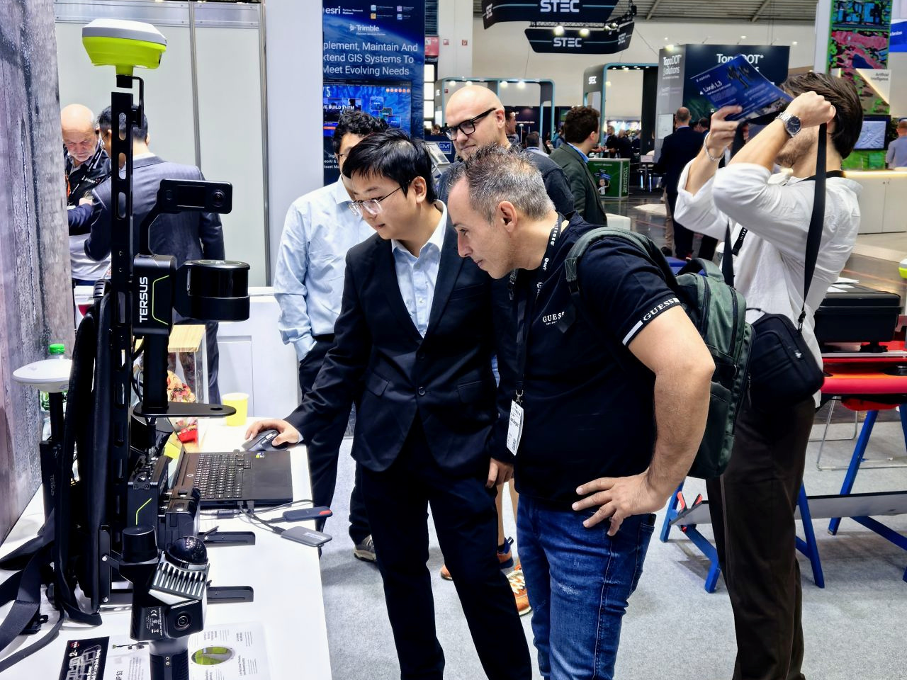 Visitors examine surveying and point cloud workflows with the TERSUS team at INTERGEO 2026