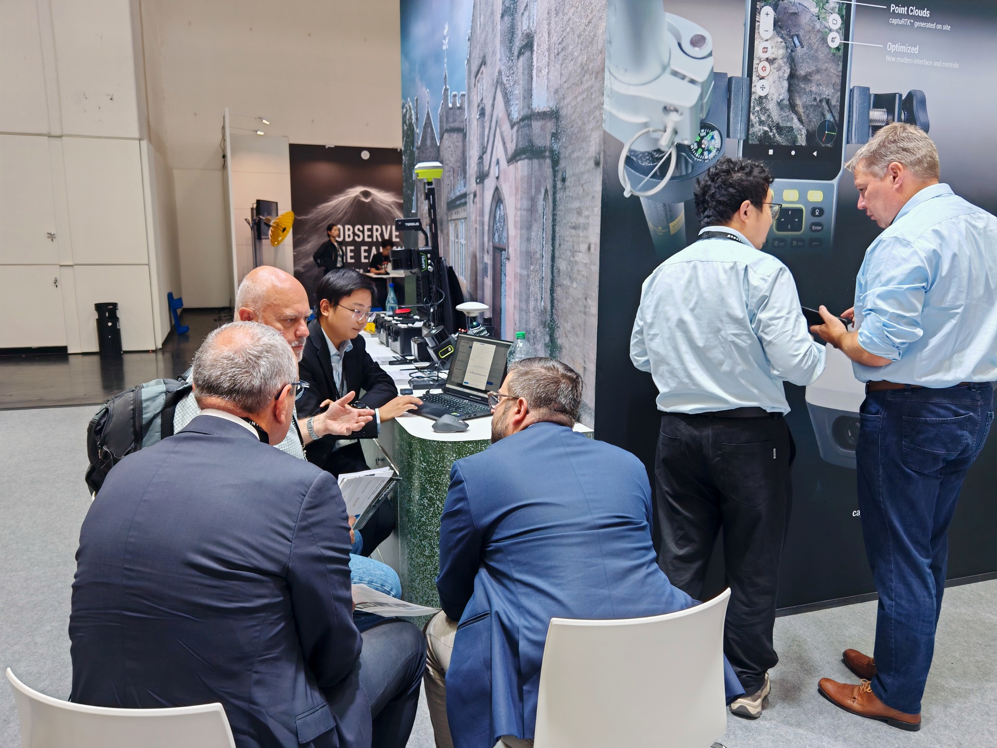 Peter Yang walks visitors through scan results at the Tersus stand, INTERGEO 2026, Munich.